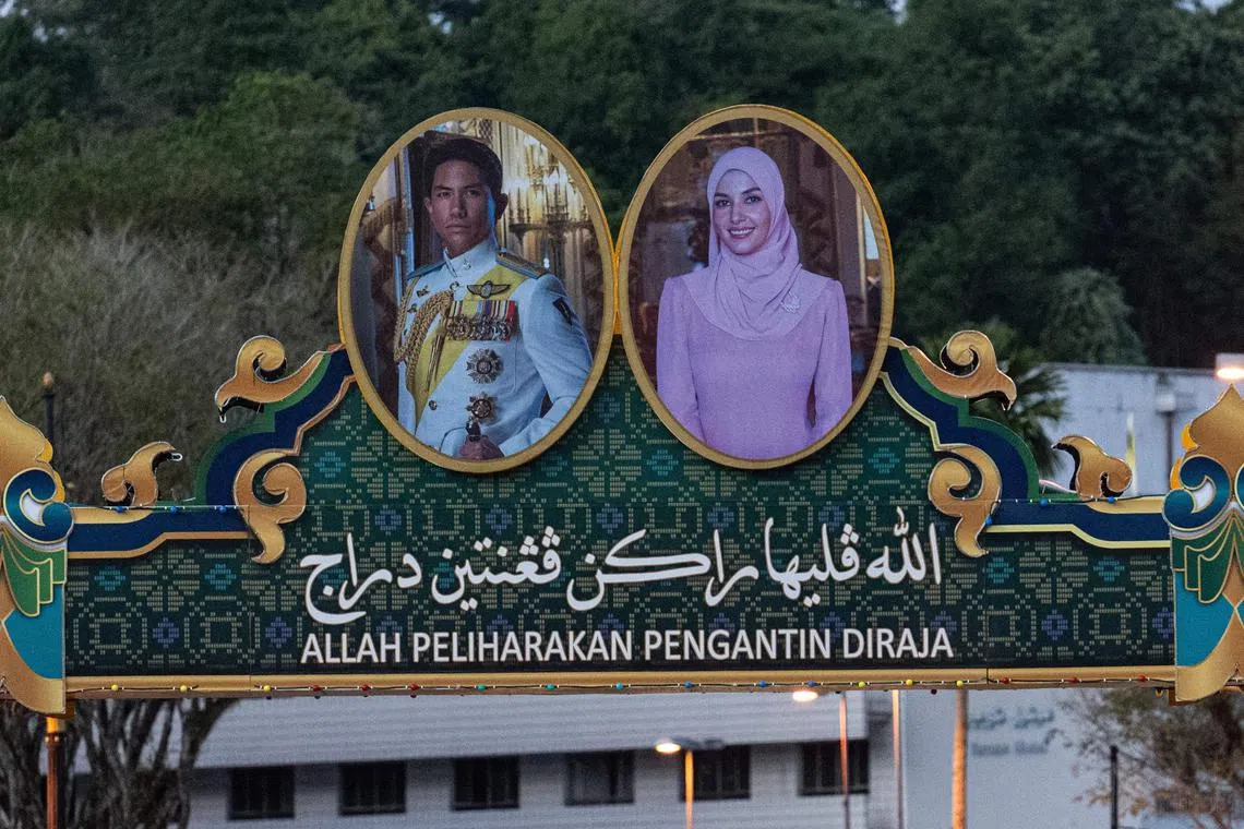 The portraits of groom Prince Abdul Mateen and bride Anisha Rosnah are pictured on a billboard over a road ahead of their wedding in Brunei.