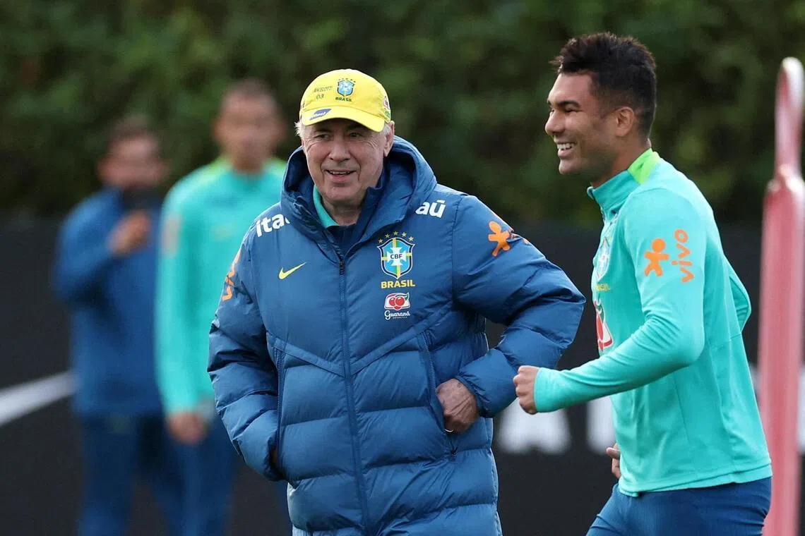 Brazil head coach Carlo Ancelotti with Casemiro during a training session in 2025.