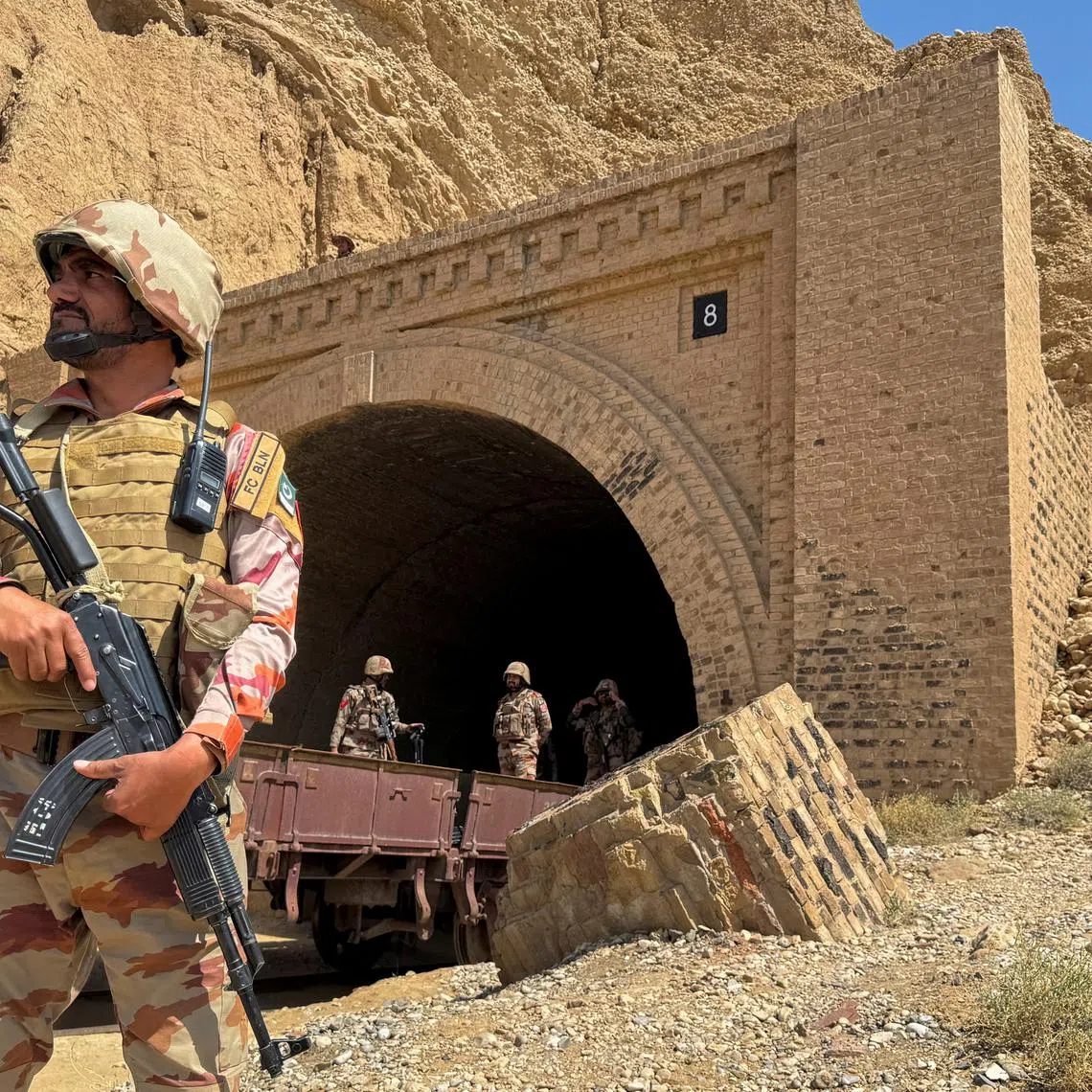 FILE PHOTO: Pakistan army soldiers stand at a tunnel where the Jaffar Express train was attacked by separatist militants, in Bolan, Balochistan, Pakistan, March 15, 2025. REUTERS/Stringer/File Photo