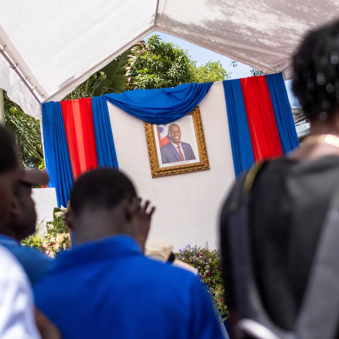 People line up to sign a condolence book in honour of late Haitian President Jovenel Moise in Cap-Haitien, Haiti July 21, 2021. REUTERS/Ricardo Arduengo