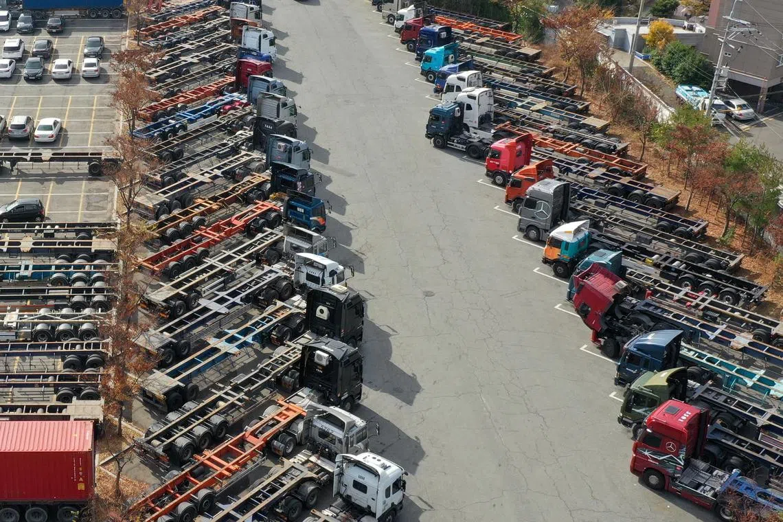 Trucks are stranded at a parking lot in Busan, South Korea, as unionised truckers affiliated with the Korean Confederation of Trade Unions press on with their strike.