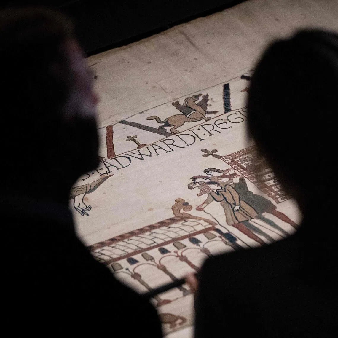 French President Emmanuel Macron (left) and his wife Brigitte Macron viewing sections of the Bayeux Tapestry during a Sept 2 preview event at the British Museum in London.
