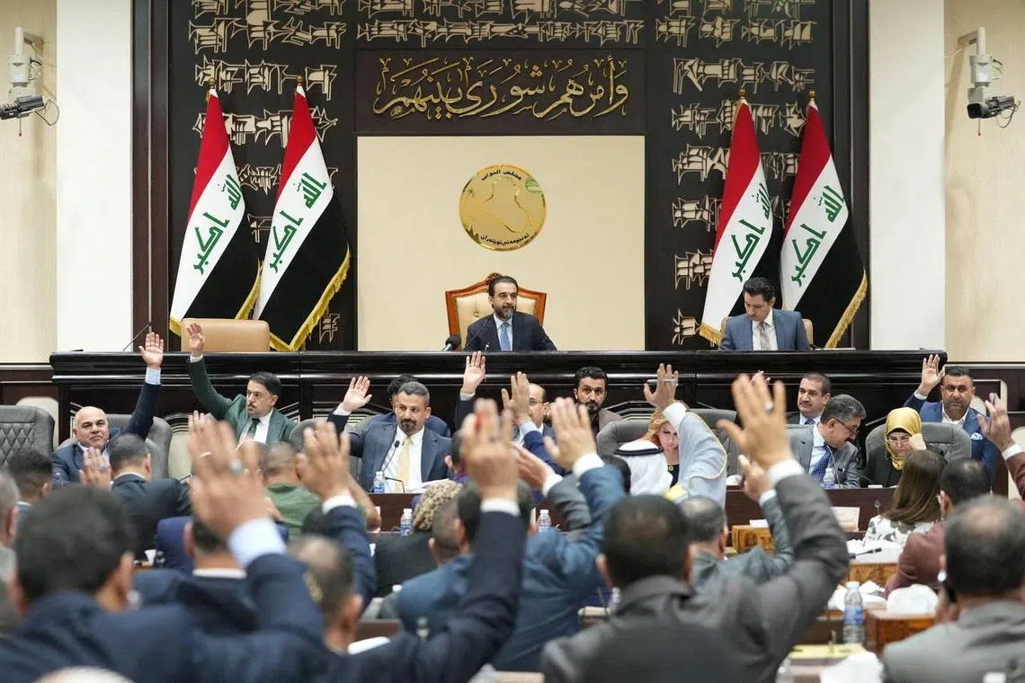 FILE PHOTO: Iraqi lawmakers attend a parliamentary session to vote on the federal budget, in Baghdad, Iraq, June 11, 2023. Iraqi Parliament Media Office/Handout via REUTERS/File Photo