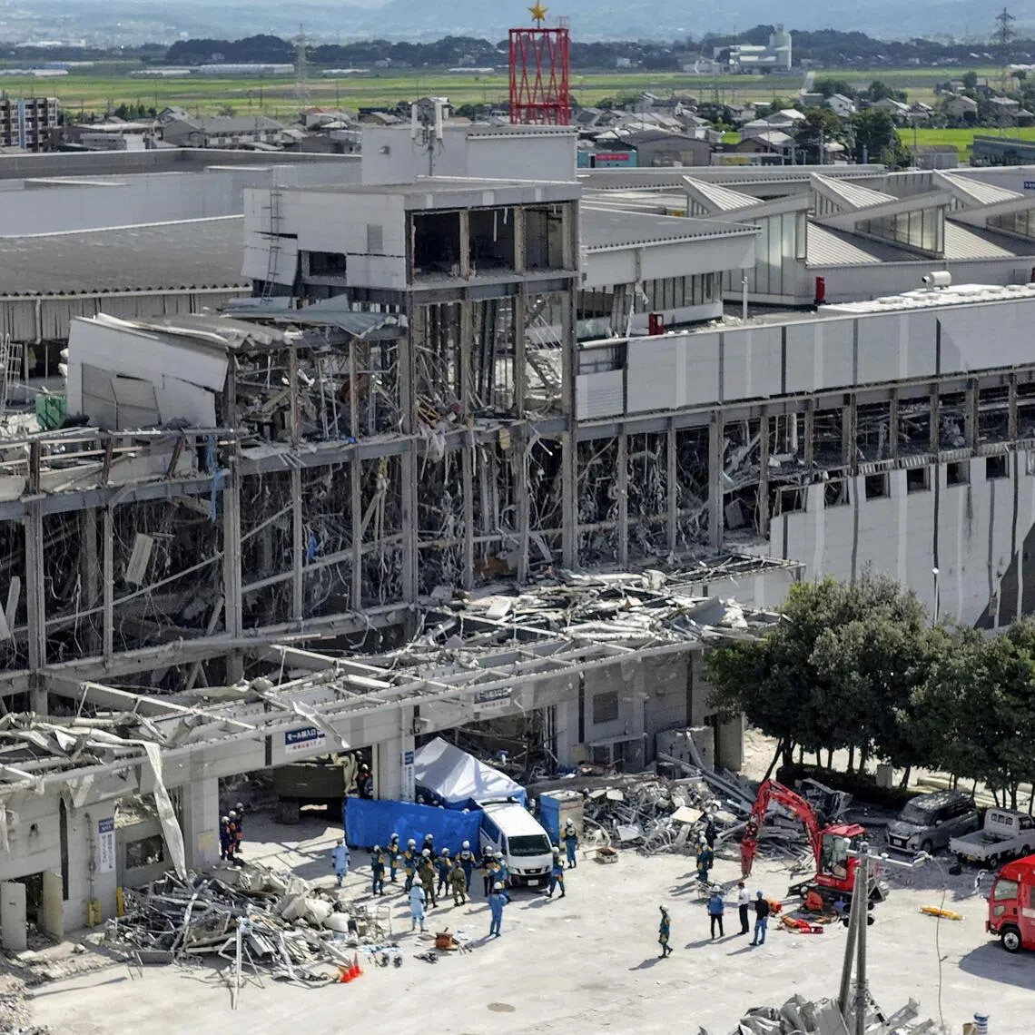 A total of 12 people were pulled from the site, including seven who were confirmed dead, according to the disaster management office of the Kumamoto region.