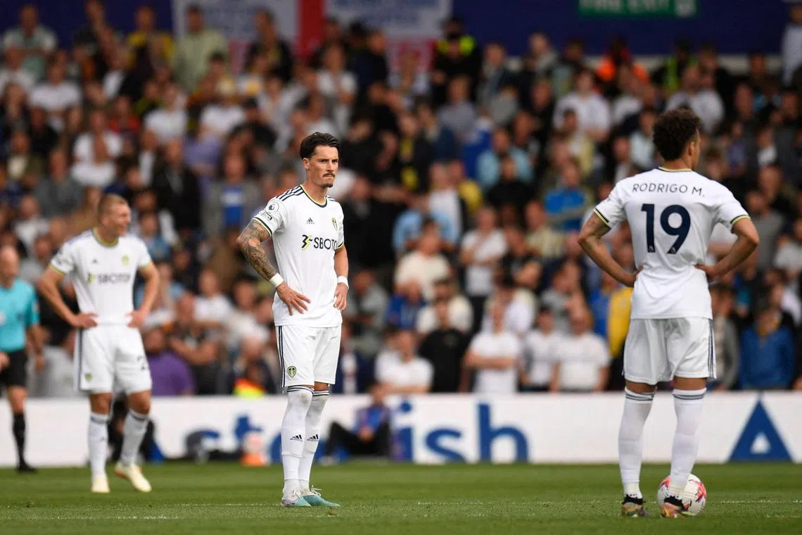 Dejected Leeds United players after their relegation from the English Premier League was confirmed following their last-day defeat by Tottenham Hotspur.