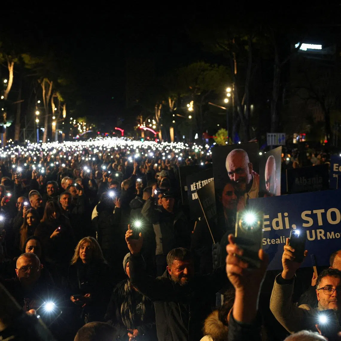 FILE PHOTO: Supporters of the Albanian opposition hold lights aloft during an anti-government protest, triggered by a corruption investigation into Deputy Prime Minister Belinda Balluku, near the Prime Minister's office in Tirana, Albania, January 24, 2026. REUTERS/Florion Goga/File Photo