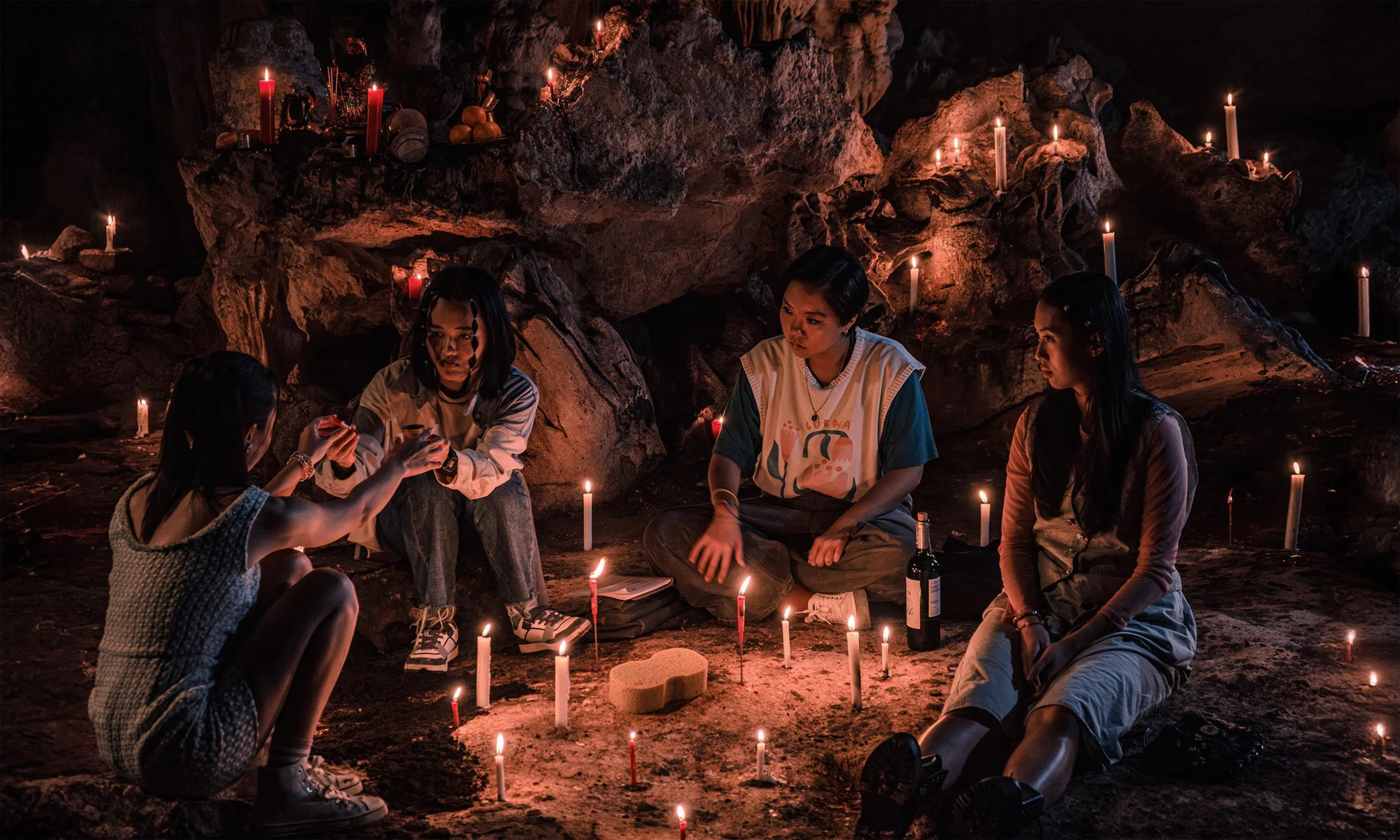 The girls (from left, Lim Shi-An, Ranice Tay, Genevieve Tan and Nicole Lee) doing their own take on a triad ceremony in a cave in Amoeba.