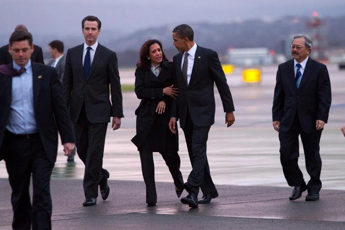 President Barack Obama walks with California Attorney General Kamala Harris as he arrives in San Francisco, on Feb 17, 2011.