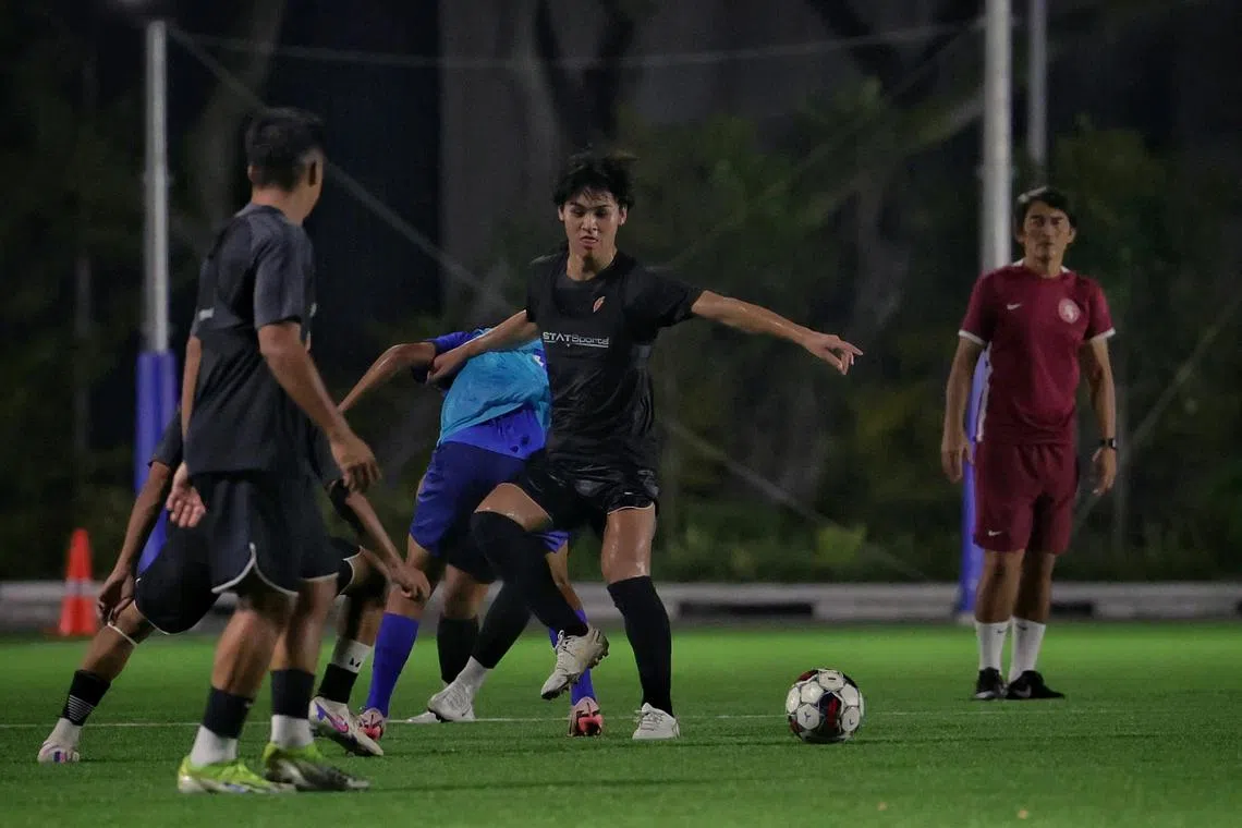 Young Lions' Kaisei Ogawa tussling for the ball under the watchful eyes of coach Nazri Nasir. The Japanese midfielder joined from Albirex Niigata in 2024.