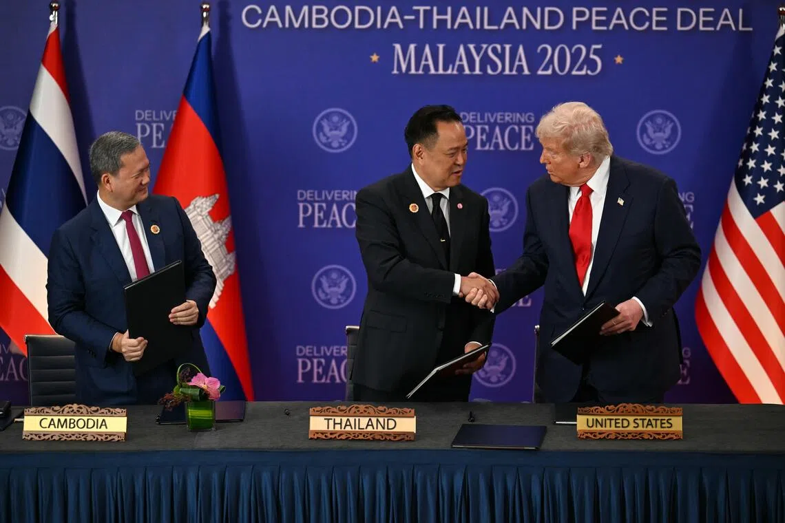 US President Donald Trump (right) oversaw the signing of an enhanced ceasefire deal between Cambodia and Thailand on Oct 26.