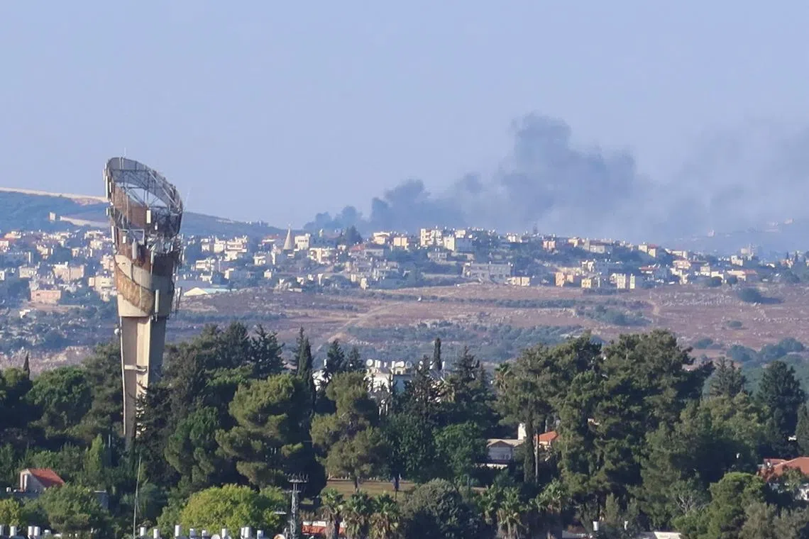 Smoke rises above Lebanon, amid cross-border hostilities between Hezbollah and Israeli forces, as seen from northern Israel on July 25.