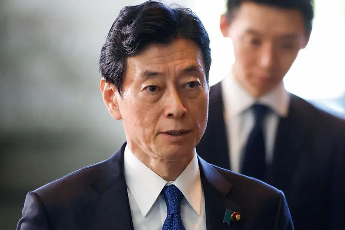 FILE PHOTO: Japan's Minister of Economy, Trade and Industry Yasutoshi Nishimura walks on the day of the cabinet reshuffle, at the Prime Minister's office in Tokyo, Japan September 13, 2023. REUTERS/Issei Kato/File Photo