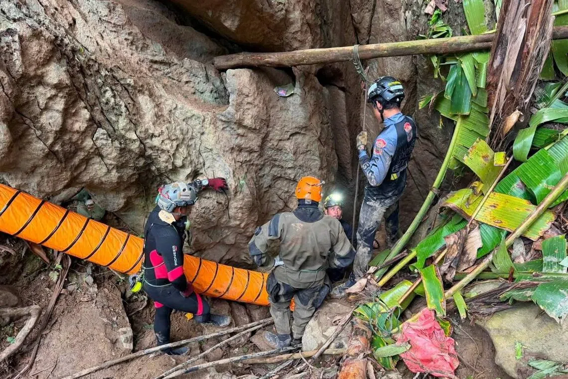 Rescue teams find five trapped in Laos cave, search for two more continues