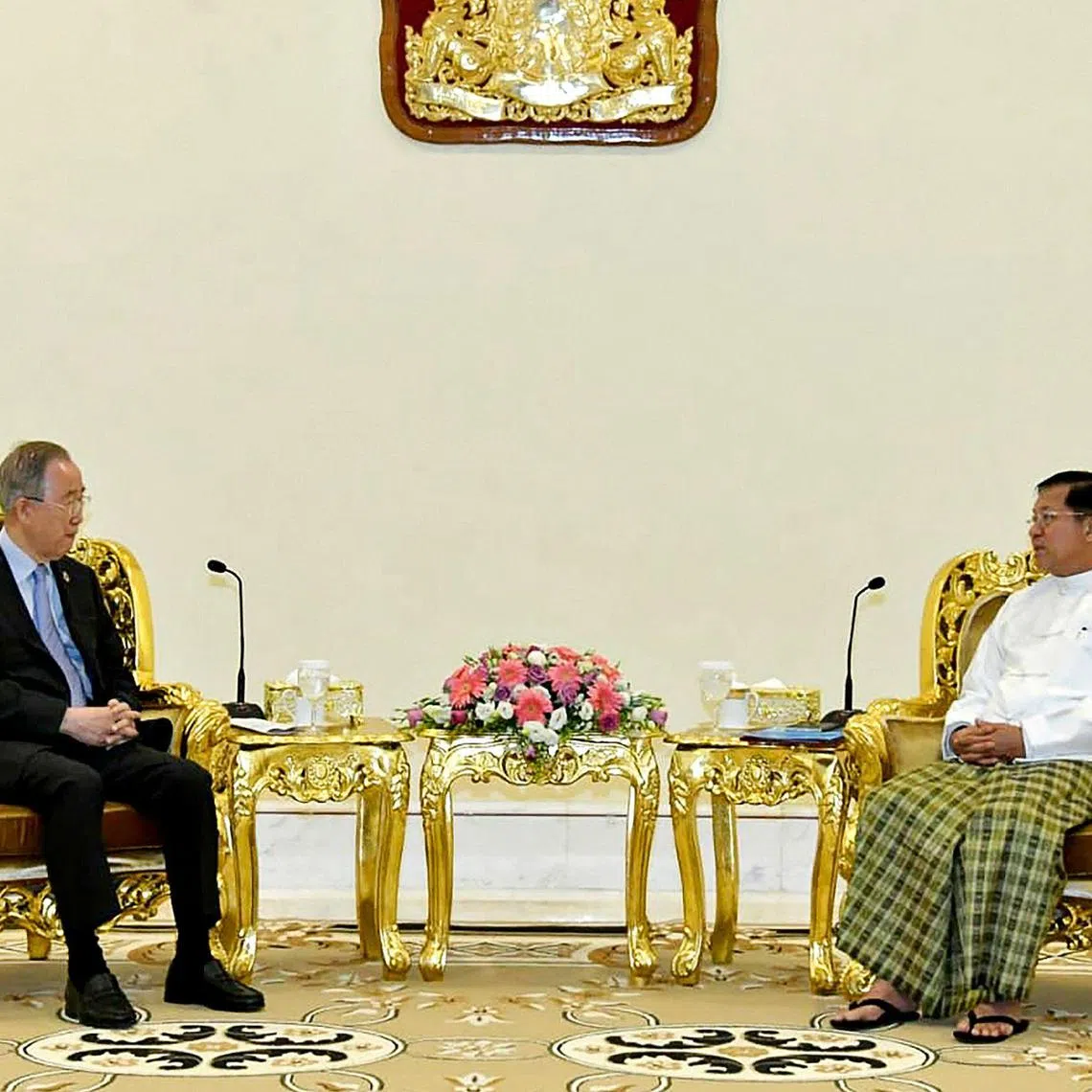 Former UN chief Ban Ki-moon (left) is seen meeting with  Myanmar junta head Min Aung Hlaing in this handout photo.