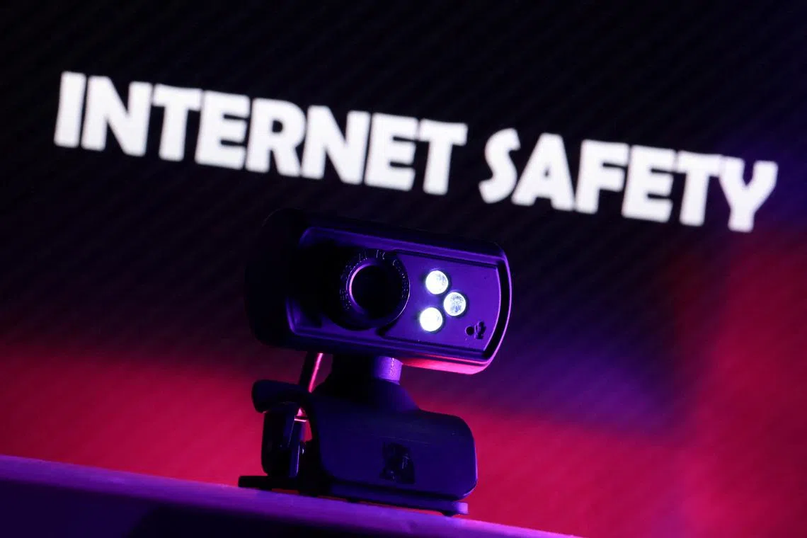 A web camera is seen in front of the displayed words \"Internet Safety\" in this illustration taken October 21, 2025. REUTERS/Dado Ruvic/Illustration