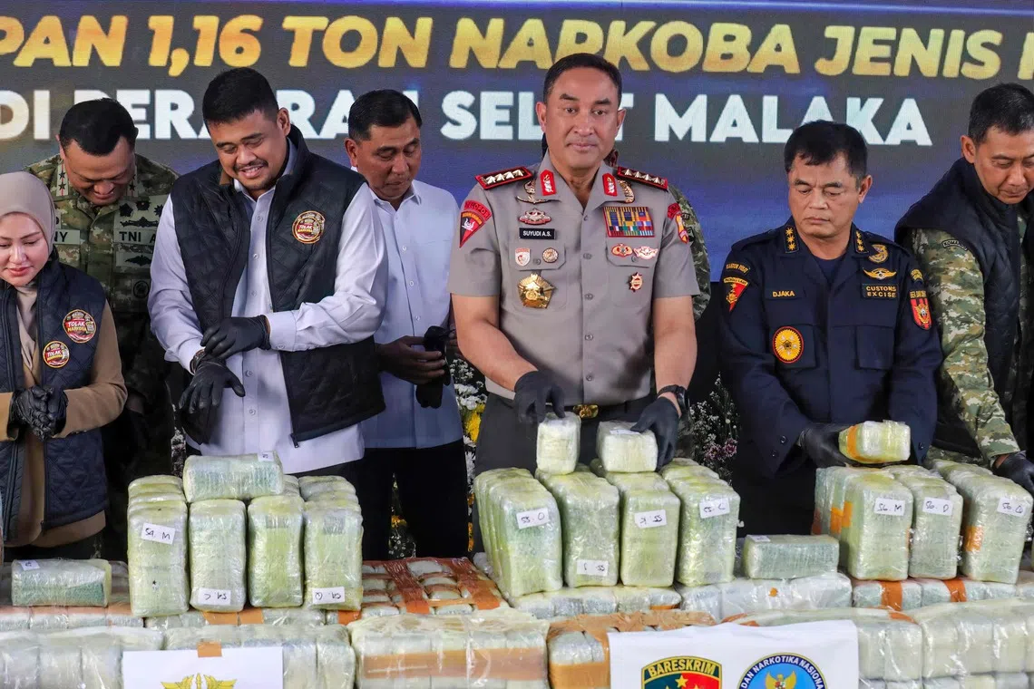 Indonesian police displaying seized drugs during a press conference in Belawan in Medan, North Sumatra province, on Oct 23.