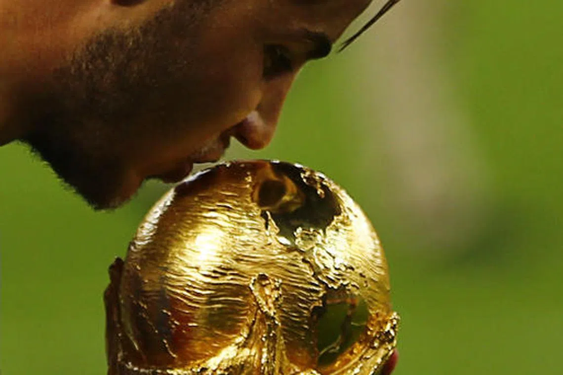 Mario Gotze kisses the World Cup after his goal in injury time won the championship for Germany in 2014.