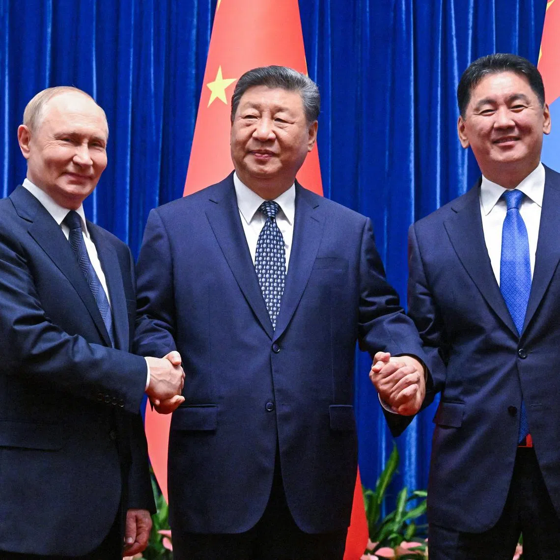 FILE PHOTO: Russian President Vladimir Putin, Chinese President Xi Jinping and Mongolian President Ukhnaagiin Khurelsukh pose for a picture before a meeting in Beijing, China September 2, 2025. Sputnik/Sergey Bobylev/Pool via REUTERS/File Photo