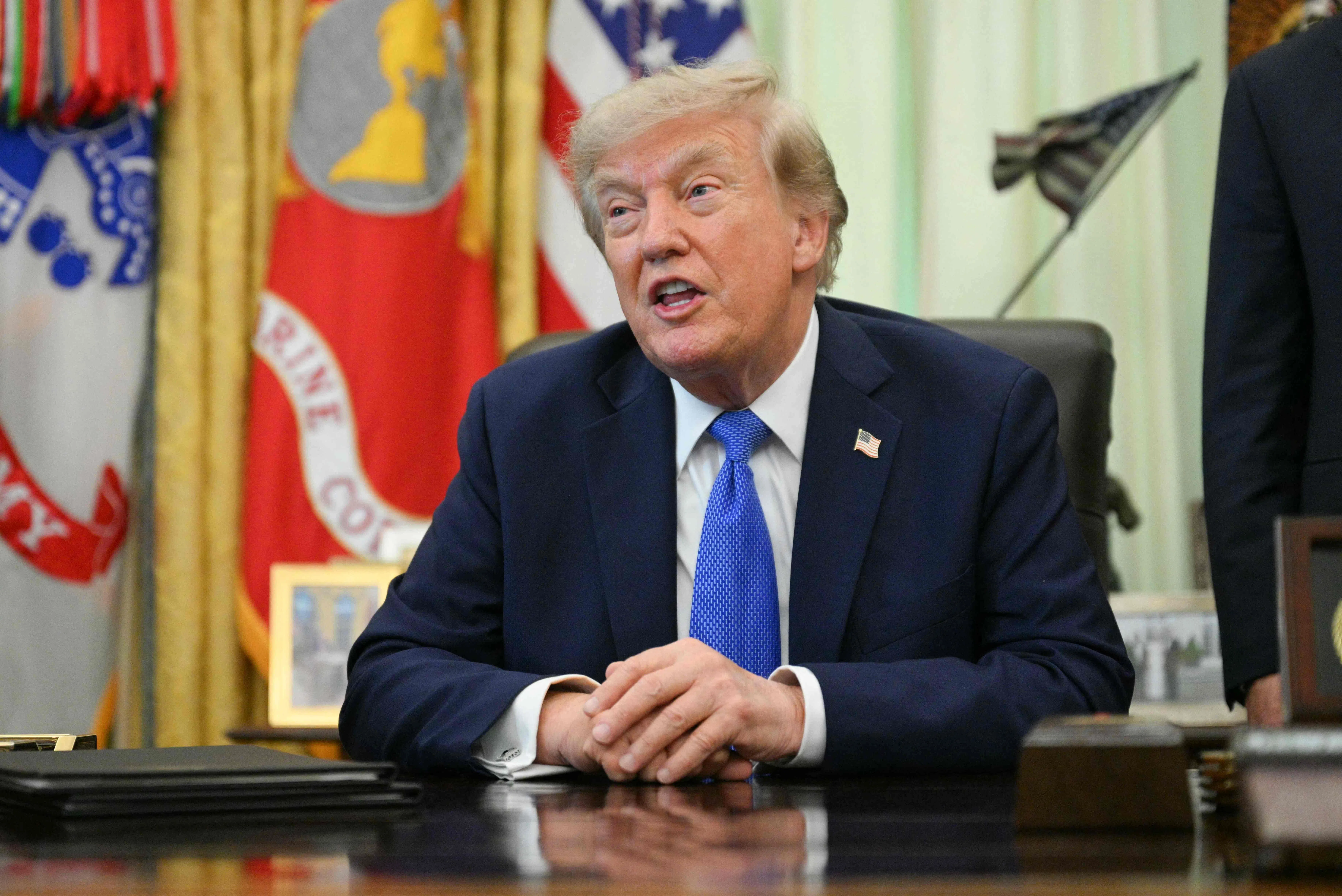 US President Donald Trump speaks after signing executive orders in the Oval Office of the White House in Washington, DC, on August 7, 2026. (Photo by Jim WATSON / AFP)
