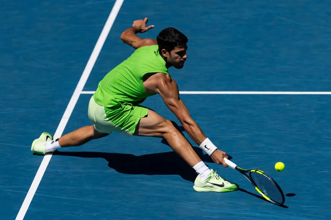 Jan 25, 2026; Melbourne, Victoria, Australia; Carlos Alcaraz of Spain in action against Tommy Paul of United States in the fourth round of the men’s singles at the Australian Open at Rod Laver Arena in Melbourne Park. Mandatory Credit: Mike Frey-Imagn Images