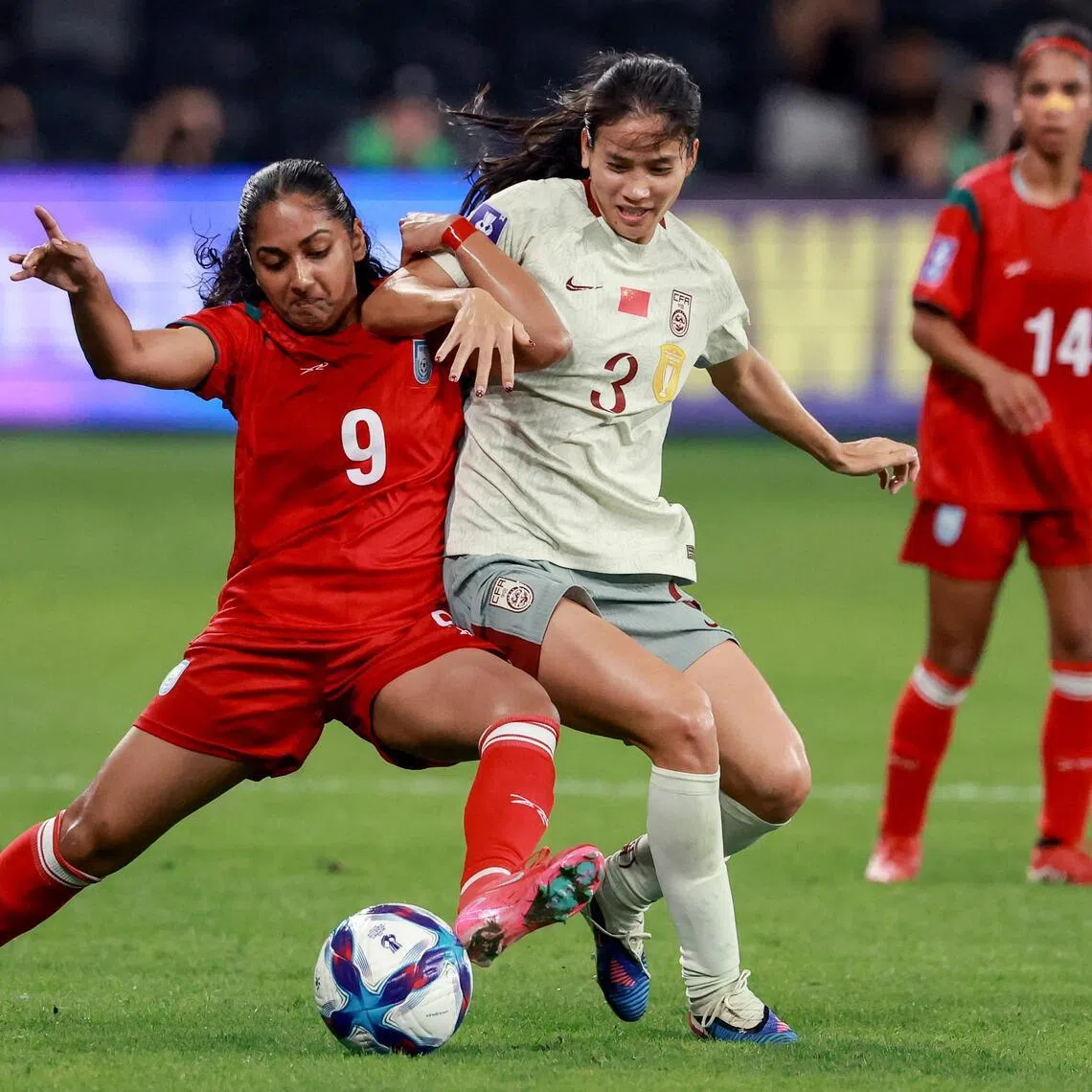 Bangladesh's Anika Siddiqui tackles China's Chen Qiaozhu during their Women's Asian Cup match.