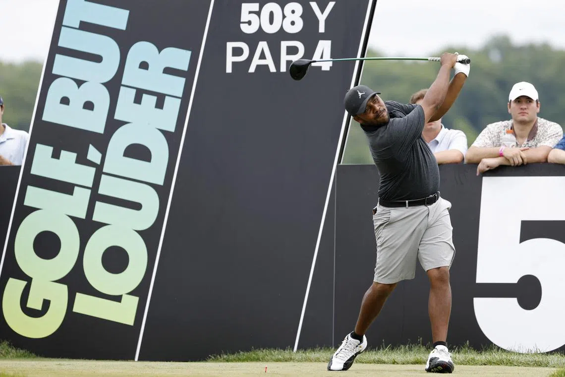 Harold Varner III hitting a tee shot on the fifth hole during the final round of LIV Golf - DC tournament at Trump National. 