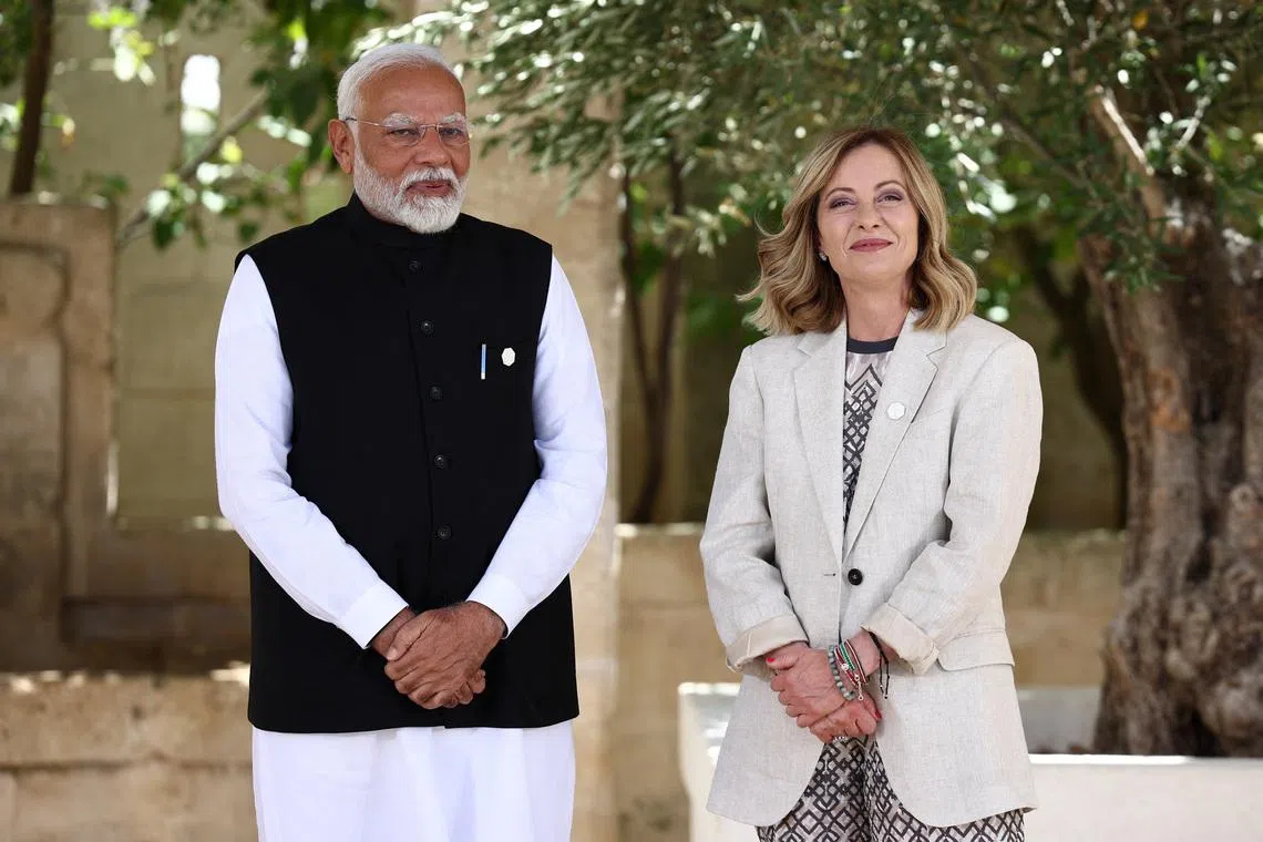 India's Prime Minister Narendra Modi  is welcomed by Italian Prime Minister Giorgia Meloni on the second day of the G7 summit, at the Borgo Egnazia resort, in Savelletri, Italy June 14, 2024. REUTERS/Guglielmo Mangiapane