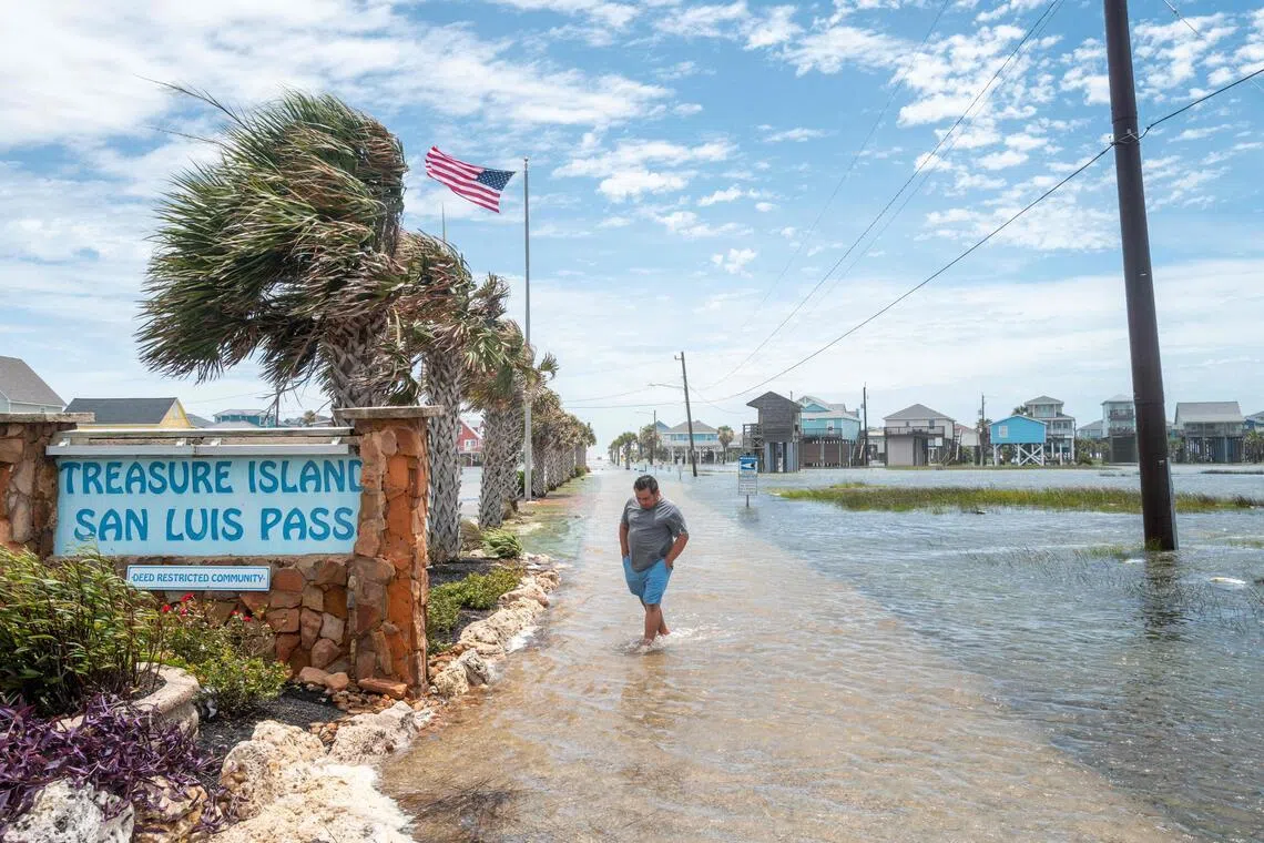 FREEPORT, TEXAS - JUNE 17: A person walks through a flooded neighborhood after Tropical Storm Arthur made landfall on June 17, 2026 in Freeport, Texas. A Tropical Storm Watch has been issued for portions of the northwestern Gulf Coast, stretching from the mid-to-upper Texas coast into Louisiana, as Tropical Storm Arthur brought heavy downpour and flooding. Tropical Storm Arthur becomes the first named storm of the Atlantic hurricane season.   Brandon Bell/Getty Images/AFP (Photo by Brandon Bell / GETTY IMAGES NORTH AMERICA / Getty Images via AFP)