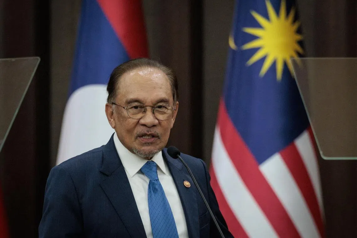 Malaysia's Prime Minister Anwar Ibrahim delivers a speech in Jakarta on July 29.
