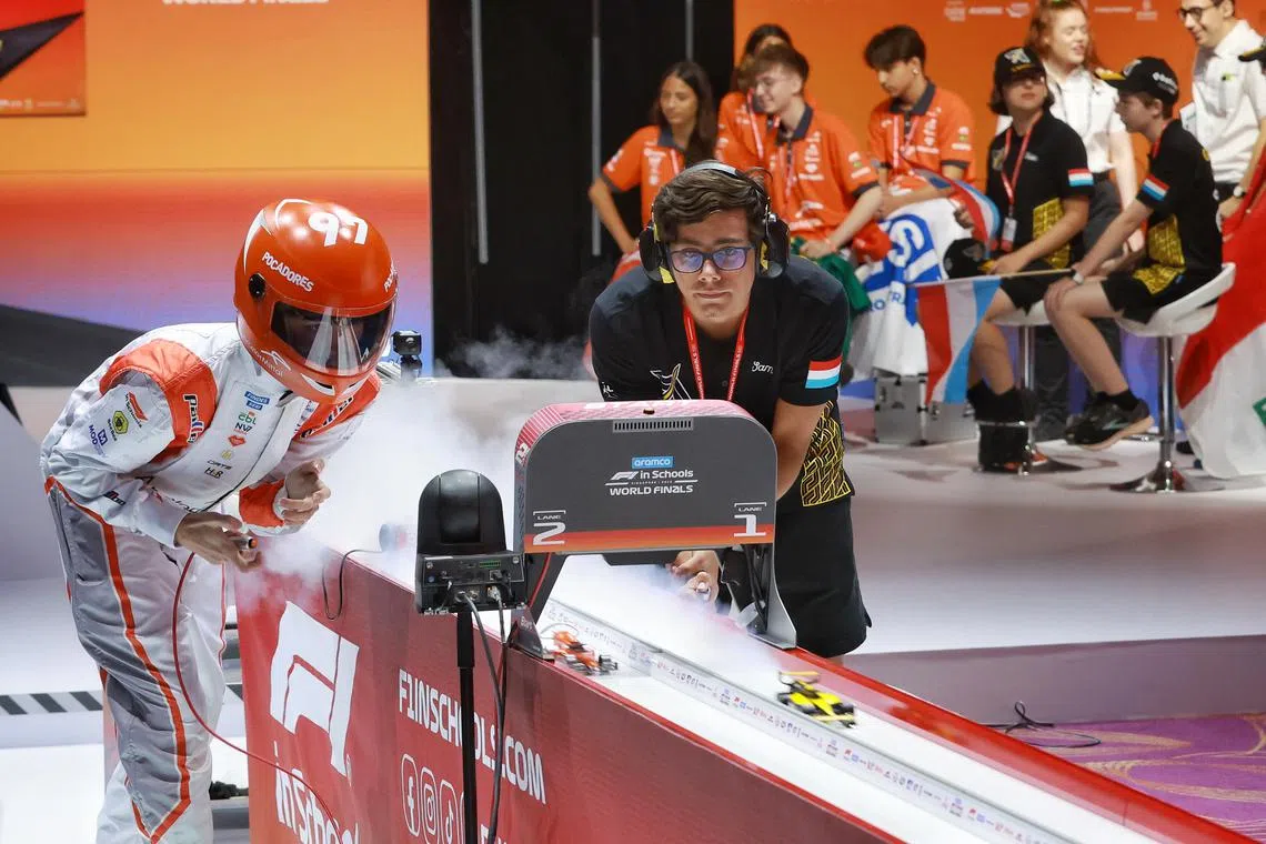 Students were required to form teams to design and manufacture miniature F1 cars, then race them along a 20-metre track.