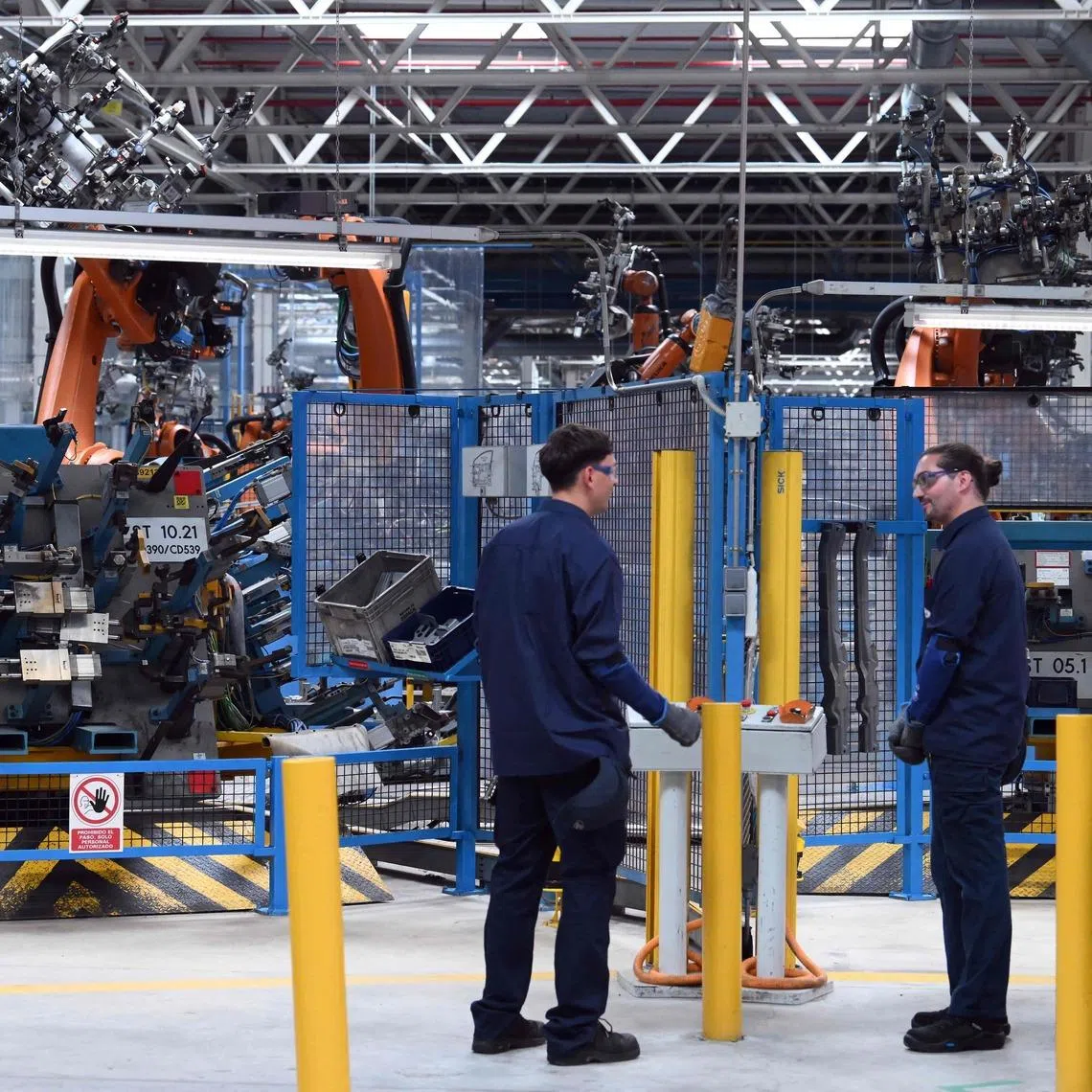 Employees work at the Ford factory in Almussafes, near Valencia, Spain, on July 23.