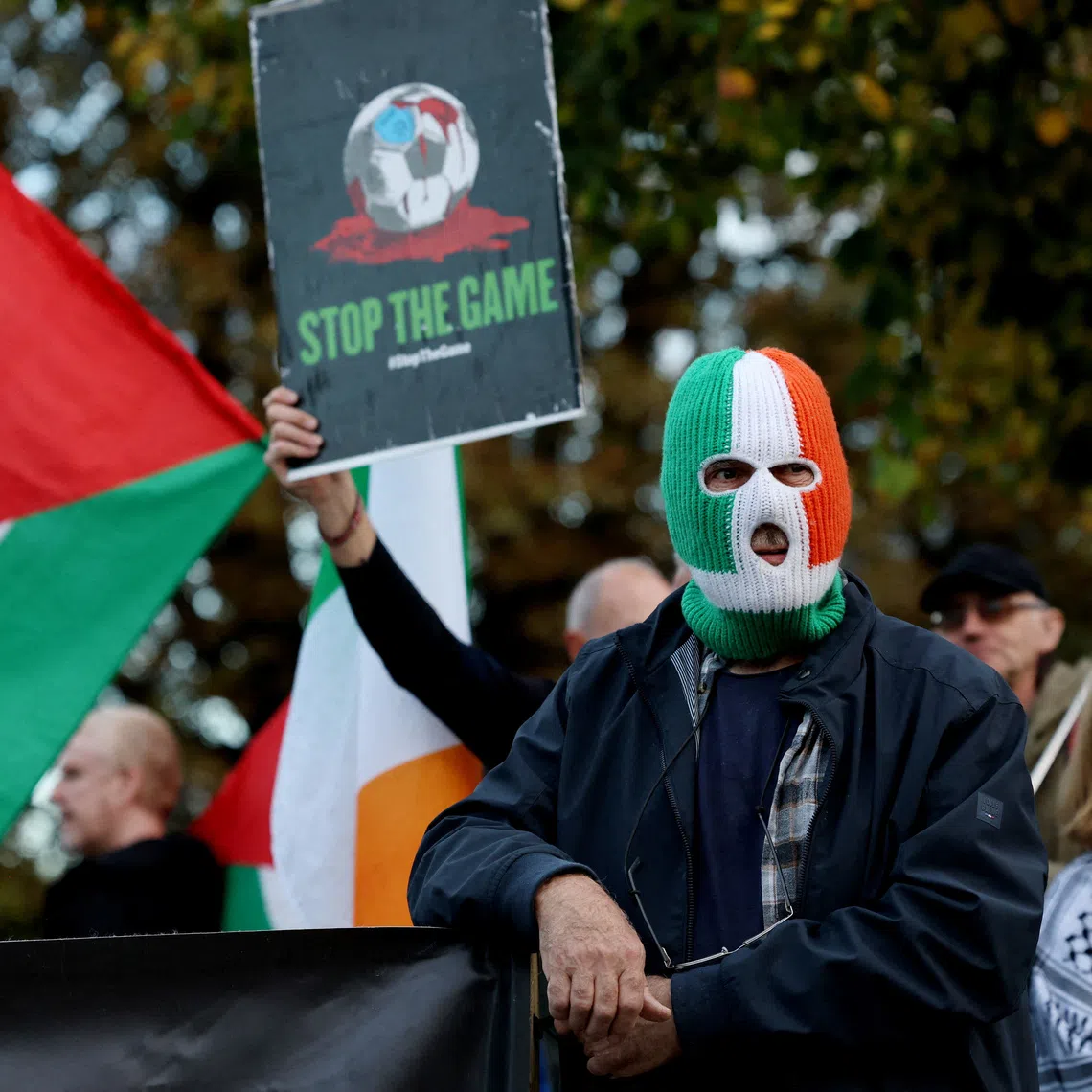 Soccer Football - UEFA Nations League - Group B3 - Republic of Ireland v Austria - Aviva Stadium, Dublin, Ireland - October 1, 2026 General view of a man wearing a balaclava during a \"Stop The Game\" protest before the match REUTERS/Cathal Mcnaughton