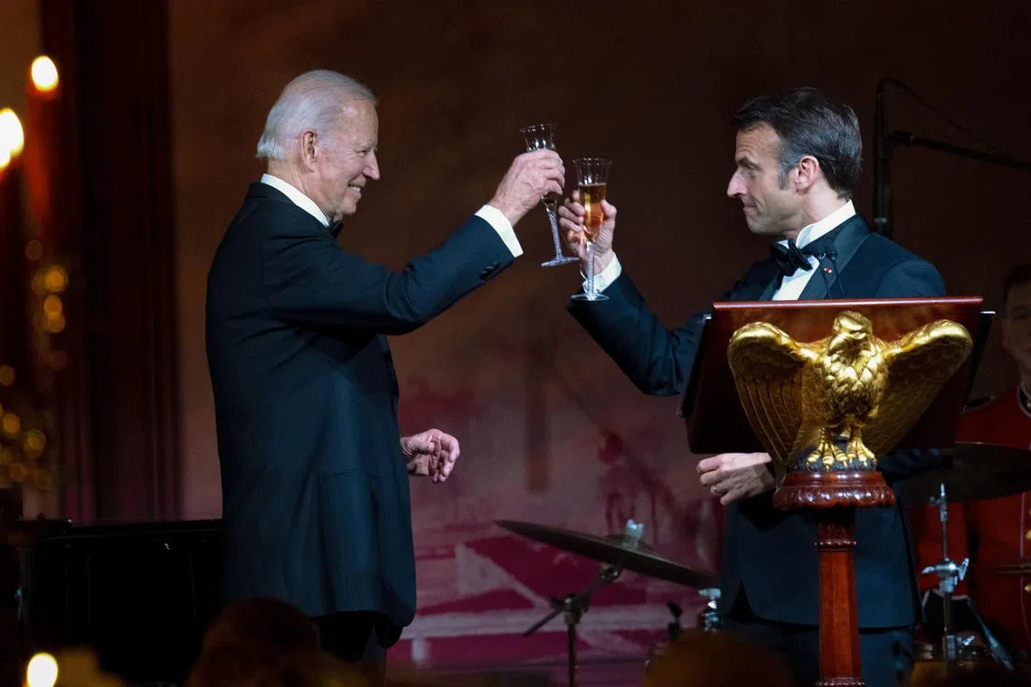 President Joe Biden joins French President Emmanuel Macron during a toast during the State Dinner at the White House, in Washington on Thursday, Dec. 1, 2022. (Doug Mills/The New York Times)