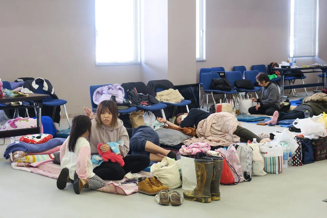 Evacuees at the Yadago District Community Centre, which serves as an evacuation shelter in Nanao, Ishikawa Prefecture. 