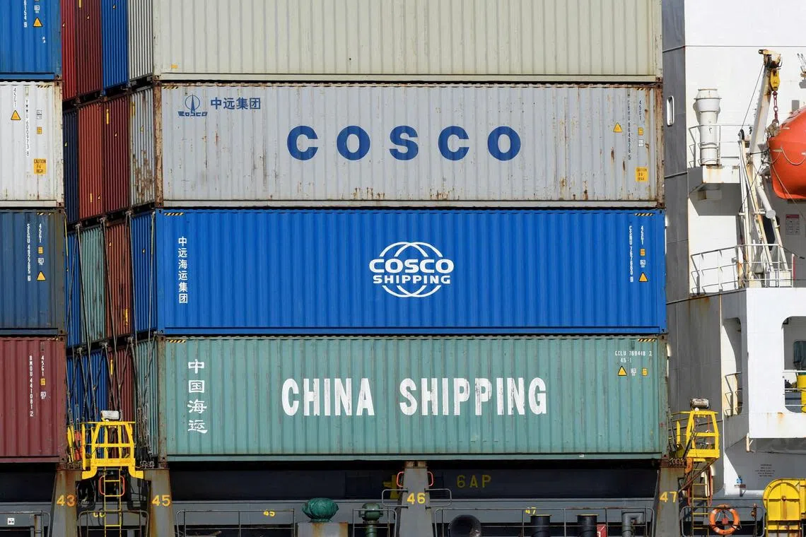 Containers of Chinese companies China Shipping and COSCO (China Ocean Shipping Company) being loaded before leaving the port in Hamburg, Germany, on March 11, 2020.