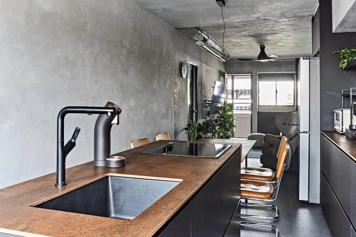 This F&B owner's kitchen island doubles as a counter and four-seater dining table, making it a key focal point of the flat.