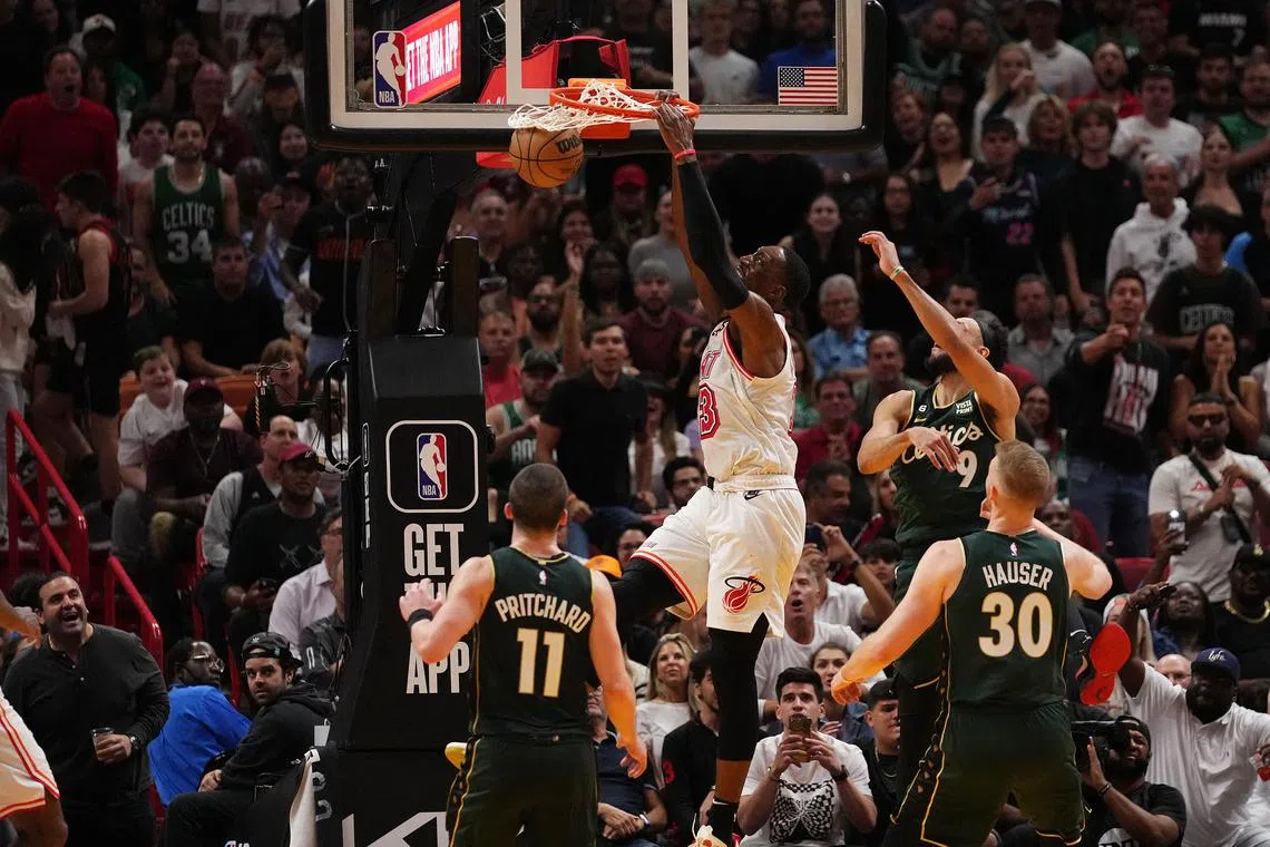 Miami Heat centre Bam Adebayo dunks the ball against the Boston Celtics during the second half at Miami-Dade Arena.