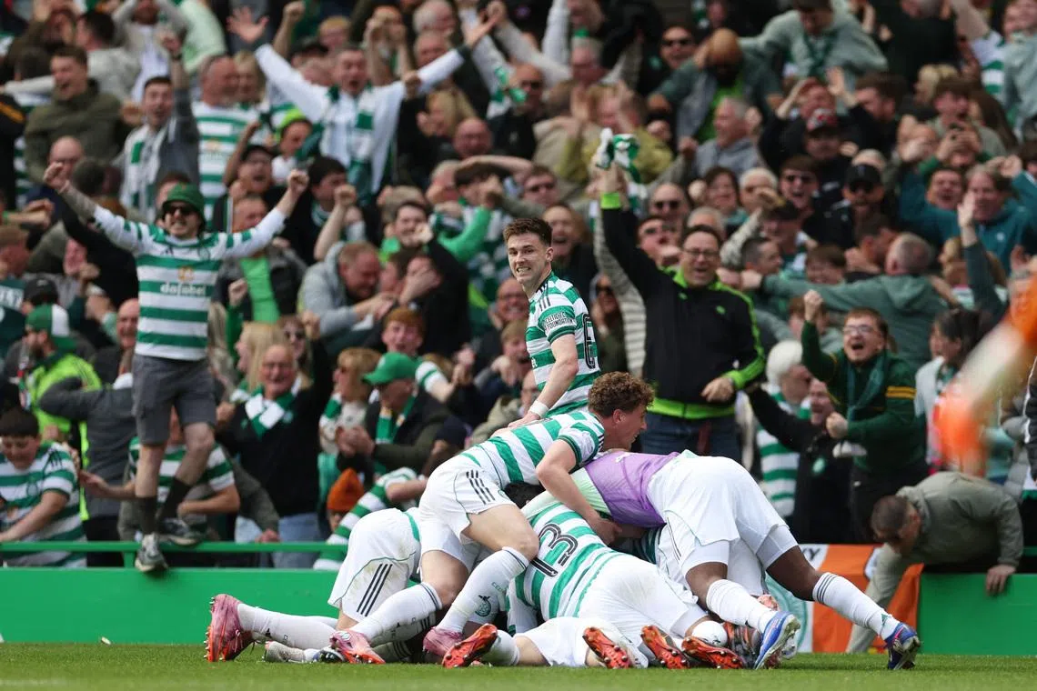 Soccer Football - Scottish Premiership - Celtic v Rangers - Celtic Park, Glasgow, Scotland, Britain - May 10, 2026 Celtic's Daizen Maeda celebrates scoring their third goal with teammates REUTERS/Russell Cheyne