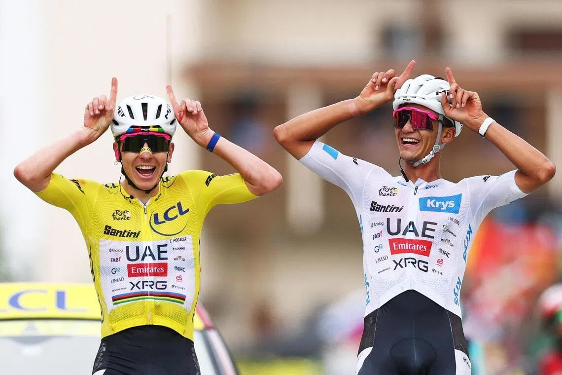 Cycling - Tour de France - Stage 20 - Le Bourg d'Oisans to Alpe d'Huez - Alpe d'Huez, France - July 25, 2026
UAE Team Emirates XRG's Tadej Pogacar wearing the yellow jersey and UAE Team Emirates XRG's Isaac Del Toro wearing the white jersey react at the end of stage 20 REUTERS/Gonzalo Fuentes