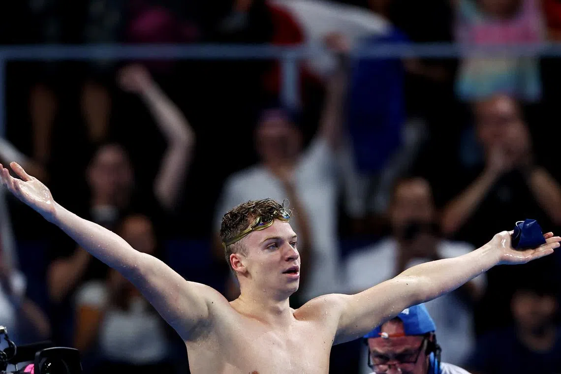 Paris 2024 Olympics - Swimming - Men's 200m Individual Medley Final - Paris La Defense Arena, Nanterre, France - August 02, 2024. Leon Marchand of France celebrates after setting an Olympic record to win gold REUTERS/Ueslei Marcelino