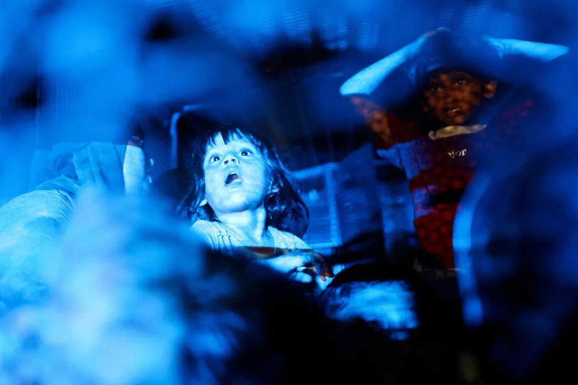 Rohingya refugees sit inside a truck as they are taken by police in front of the office of the U.N. Refugee Agency after being evicted from their homes, at Kuala Lumpur Malaysia July 27, 2026. REUTERS/Hasnoor Hussain      TPX IMAGES OF THE DAY     