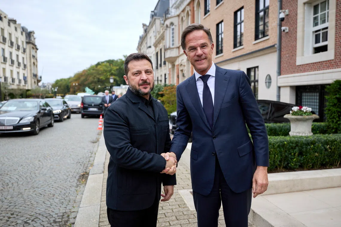 Ukraine’s President Volodymyr Zelensky (left) with NATO Secretary General Mark Rutte upon his arrival for a European Council summit, in Brussels, Belgium, on Oct 15.