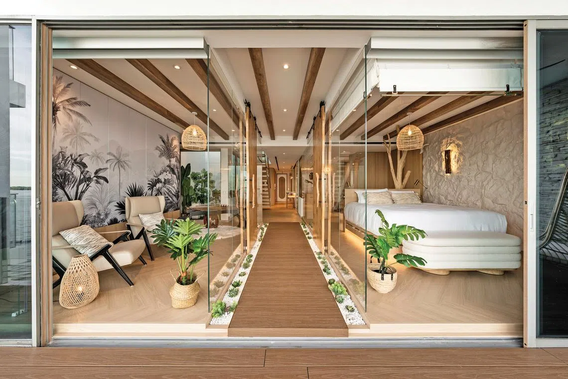 Designer Carmen Tang describes the lower level’s layout as that of a beach boulevard flanked by glass pavilions.