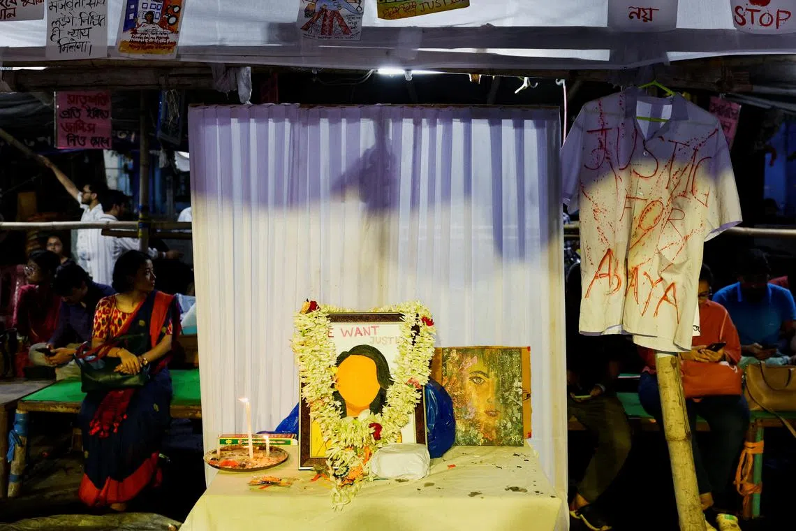 FILE PHOTO: Medics sit behind an altar of framed images as they attend a protest condemning the rape and murder of a trainee medic, inside the premises of R G Kar Medical College and Hospital in Kolkata, India, August 20, 2024. REUTERS/Sahiba Chawdhary/File photo