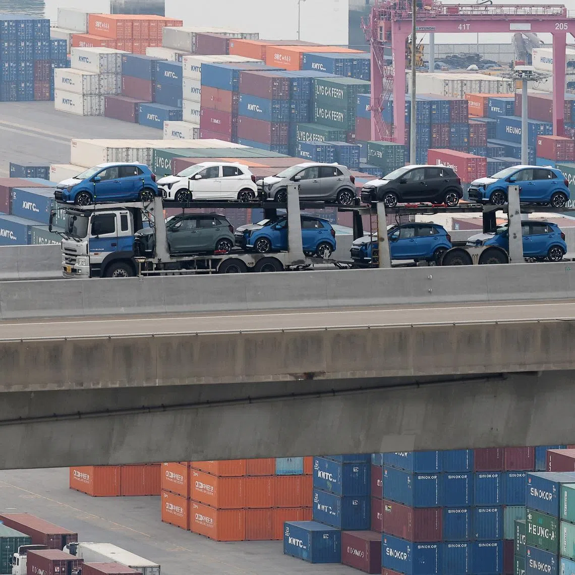 A car carrier transporting vehicles made by South Korea's automaker Kia Motors which is a sister company of South Korea’s biggest automaker company Hyundai Motors, travels near Pyeongtaek port in Pyeongtaek, South Korea, April 2, 2025.   REUTERS/Kim Hong-Ji