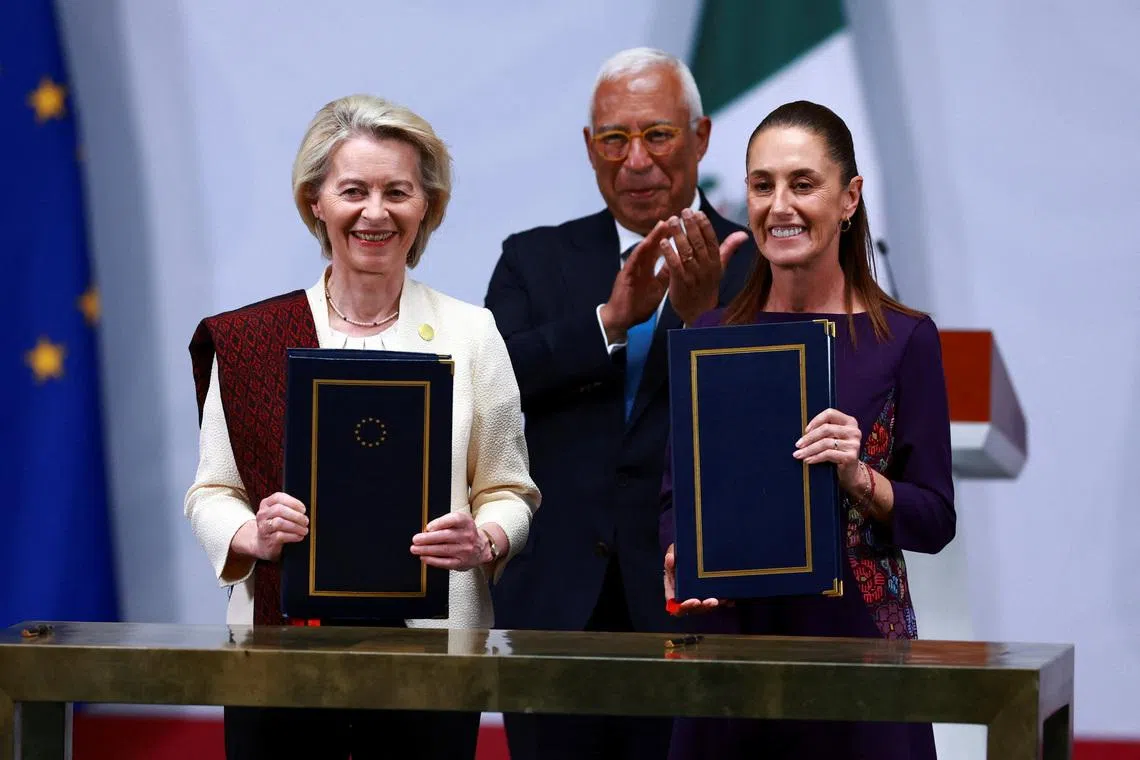 Mexican President Claudia Sheinbaum, European Commission President Ursula von der Leyen and European Council President Antonio Costa pose for a picture as they attend the signing of a long-stalled free trade agreement at the National Palace in Mexico City, Mexico, May 22, 2026. REUTERS/Raquel Cunha