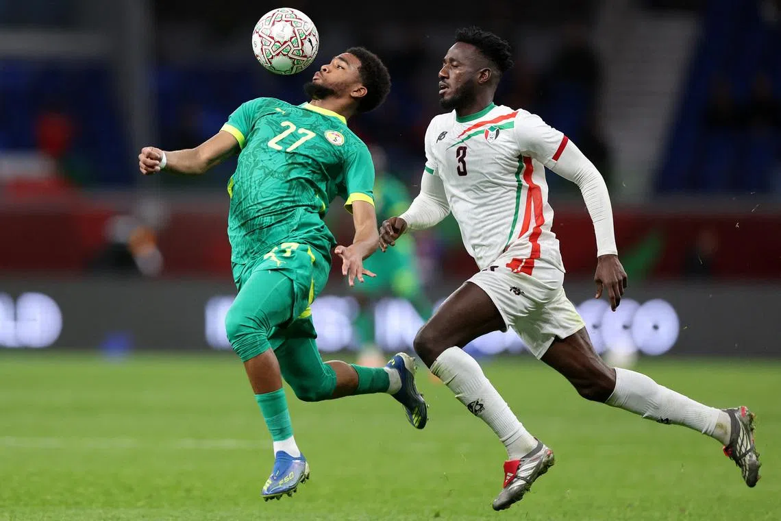 Soccer Football - CAF Africa Cup of Nations - Morocco 2025 - Round of 16 - Senegal v Sudan - Tangier Grand Stadium, Tangier, Morocco - January 3, 2026 Senegal's Ibrahim Mbaye in action with Sudan's Mohamed Saeed Ahmed REUTERS/Amr Abdallah Dalsh