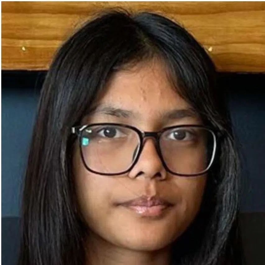 El Amrithanjali (left), 14, was wearing a wearing white blouse and light-blue skirt. Daeng Nur'adriani (right) was in a dark-blue polo top with a light-blue skirt.