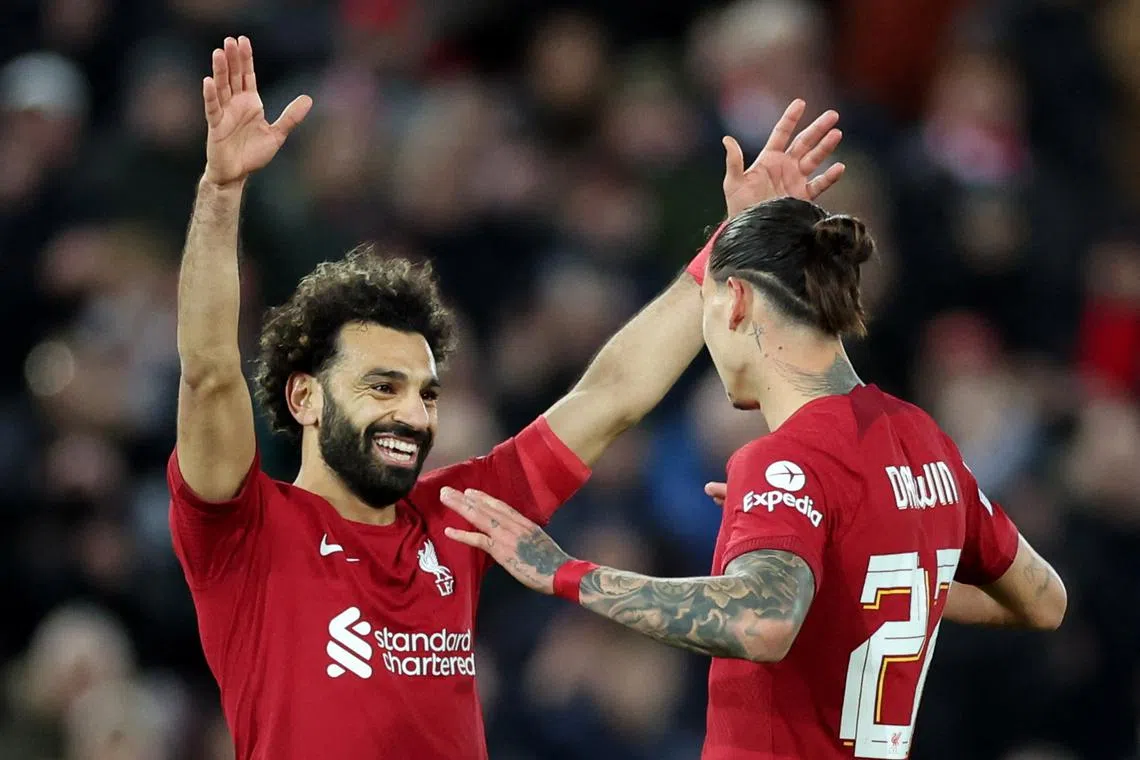 Liverpool's Darwin Nunez (right) celebrates scoring their second goal with Mohamed Salah.
