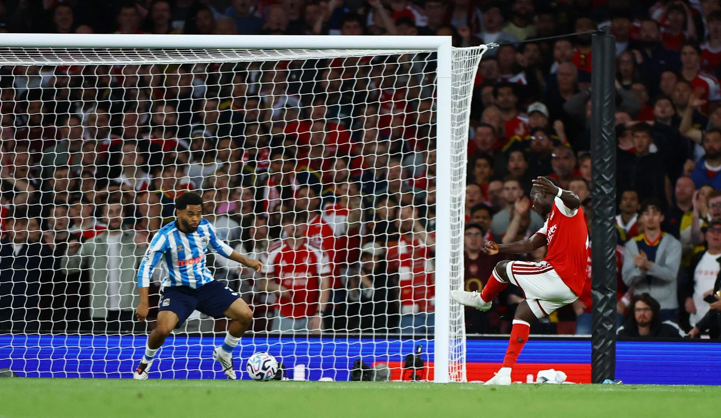 Arsenal’s Bukayo Saka scores their second goal.